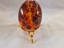 russian pressed amber egg on stand 73 .3 g
