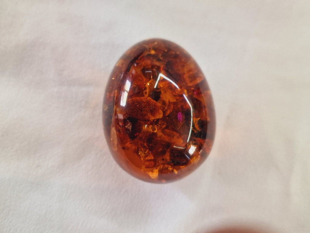russian pressed amber egg on stand 73 .3 g